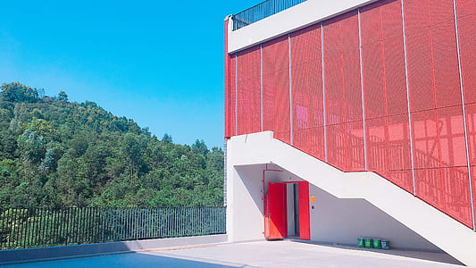 red and white concrete building during daytime thumbnail