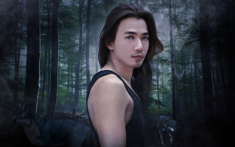 man wearing black tank top with forest background thumbnail