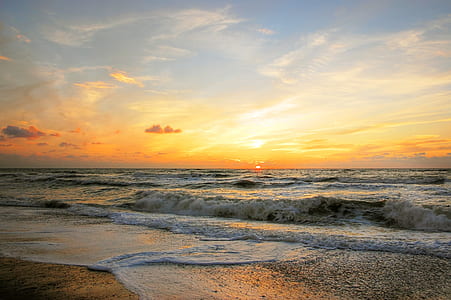 closeup photo of shore under white clouds during sunset thumbnail