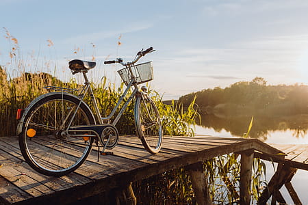 Bicycle with basket on the pier in bright sunset light thumbnail