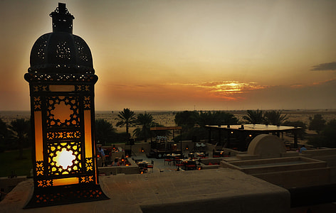 brown and orange illuminated lamp on balcony thumbnail