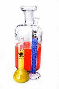 three assorted laboratory instruments filled with liquids thumbnail
