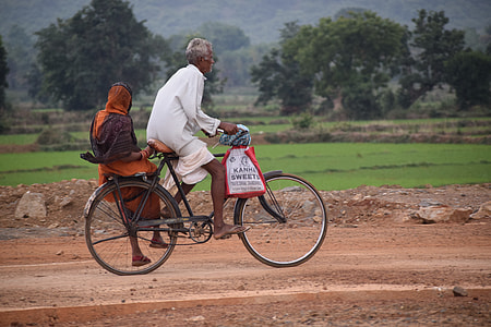 man and woman riding bicycle thumbnail