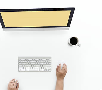 magic keyboard beside white ceramic mug thumbnail