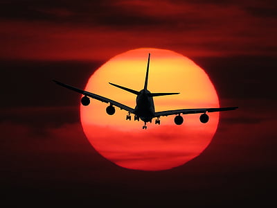 silhouette photo of air liner during golden hour thumbnail