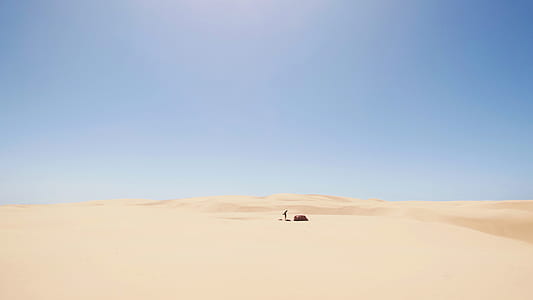 person in the middle of the desert during daytime thumbnail