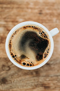 flat lay photography of brewed coffee filled teacup thumbnail