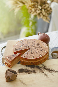 round caramel cake on brown chopping board thumbnail