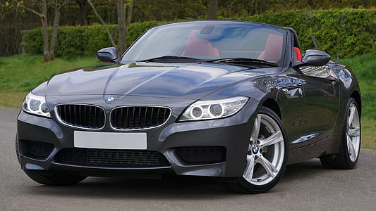black BMW convertible coupe the road during day time thumbnail