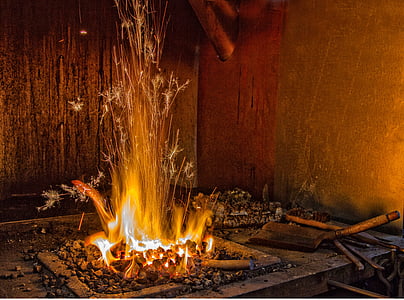 coal burning near brown metal tool thumbnail