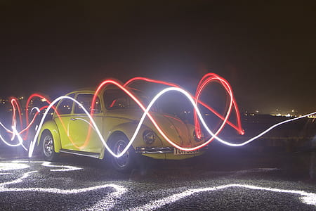 yellow Volkswagen beetle with neon lights thumbnail