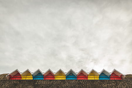 architectural photography of red, yellow, and blue houses thumbnail