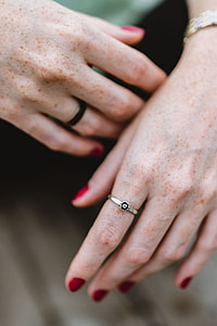 Detail of woman's hands and jewelry thumbnail