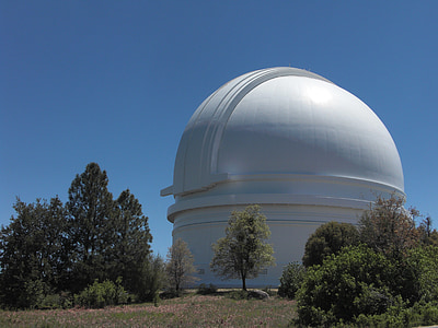 white dome building beside trees at daytime thumbnail