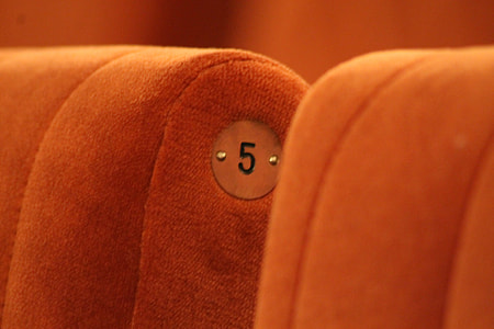 orange fabric chair in close-up photo thumbnail