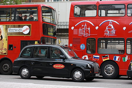vehicles at the road near building during day thumbnail