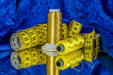 yellow thread on black textile thumbnail