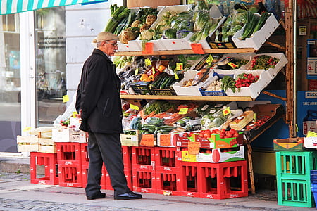 man looking at vegetables display thumbnail