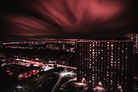 aerial photography of city buildings during night time thumbnail