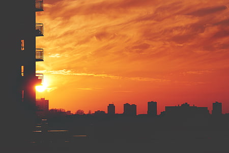 silhouette of buildings during sunset thumbnail