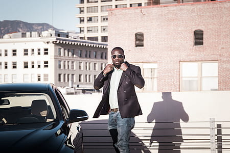 person standing near car thumbnail