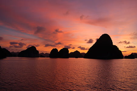 calm body of water near scattered large island thumbnail