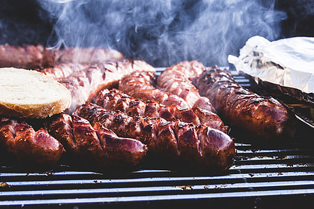 Meat and sausages cooking on BBQ thumbnail