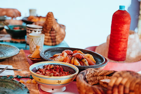 cooked dishes on red table near plates thumbnail