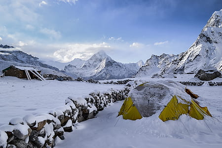 yellow dome tent covered in snow thumbnail
