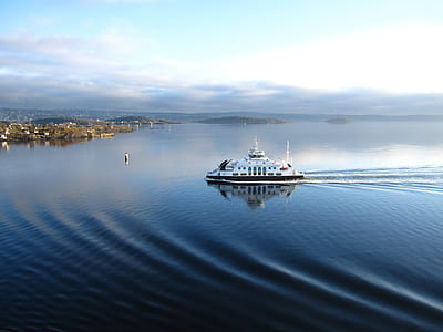 white ship on ocean at daytime thumbnail