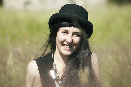 selective focus photograph of woman in black top thumbnail