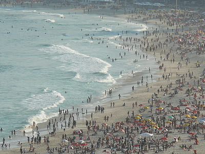 people gathered on seashore at daytime thumbnail