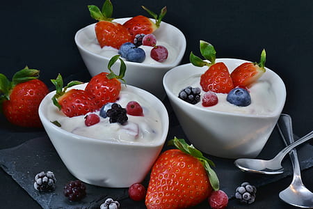 strawberry with cream in white ceramic bowls thumbnail