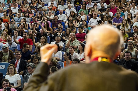 man standing in front of people thumbnail