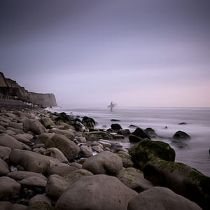 man standing near shore thumbnail