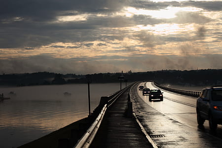 vehicles passing by bridge thumbnail