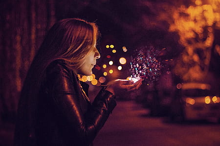 woman blowing on glitters thumbnail
