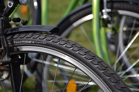 selective focus photo of black TourRide bicycle wheel thumbnail
