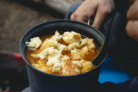 Person Cooking Food in Casserole thumbnail