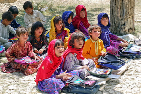 children sitting on ground during daytime thumbnail