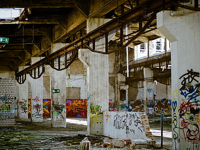 white building interior with assorted graffiti wall art thumbnail