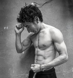 grayscale photography of man standing thumbnail