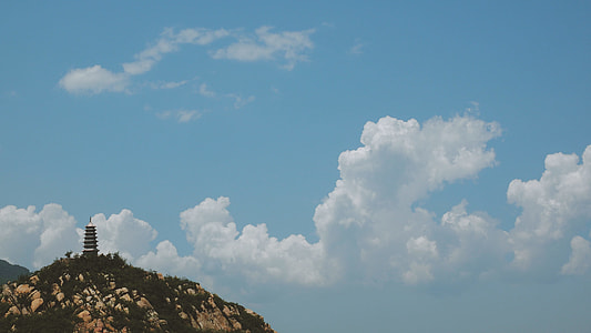 lighthouse on hill taken at daytime thumbnail