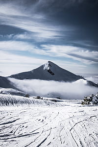 snow covered field and glacier mountain at the distance during day thumbnail
