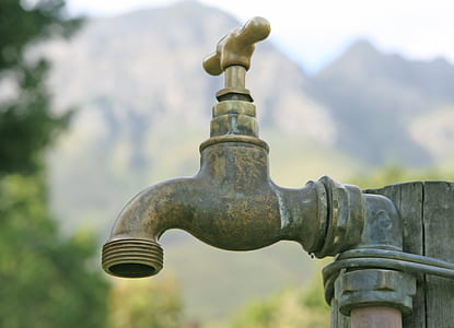 selective focus photo of brown spigot thumbnail
