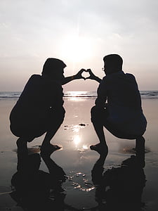 men forming heart using their hands thumbnail