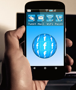 person holding turned-on smartphone thumbnail
