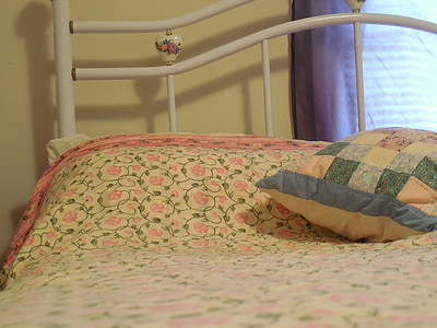 pillow on bed near window thumbnail