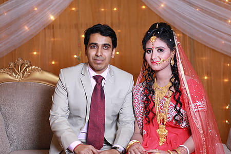 Man Wearing Gray Suit Near Woman Wearing Pink Saree Traditional Dress thumbnail