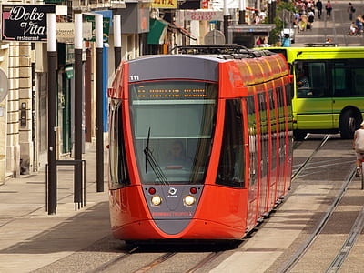 red cable train near building thumbnail